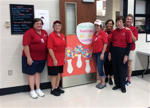 Food service workers stand together in a group. Food service workers stand together in a group.